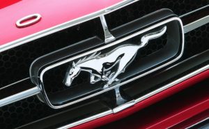 SLR verges Mustang logo